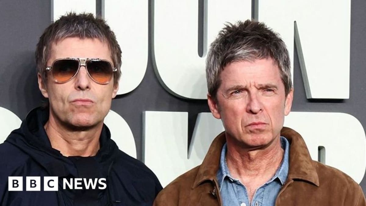 Noel and Liam Gallagher of Oasis performing together on reunion tour stage