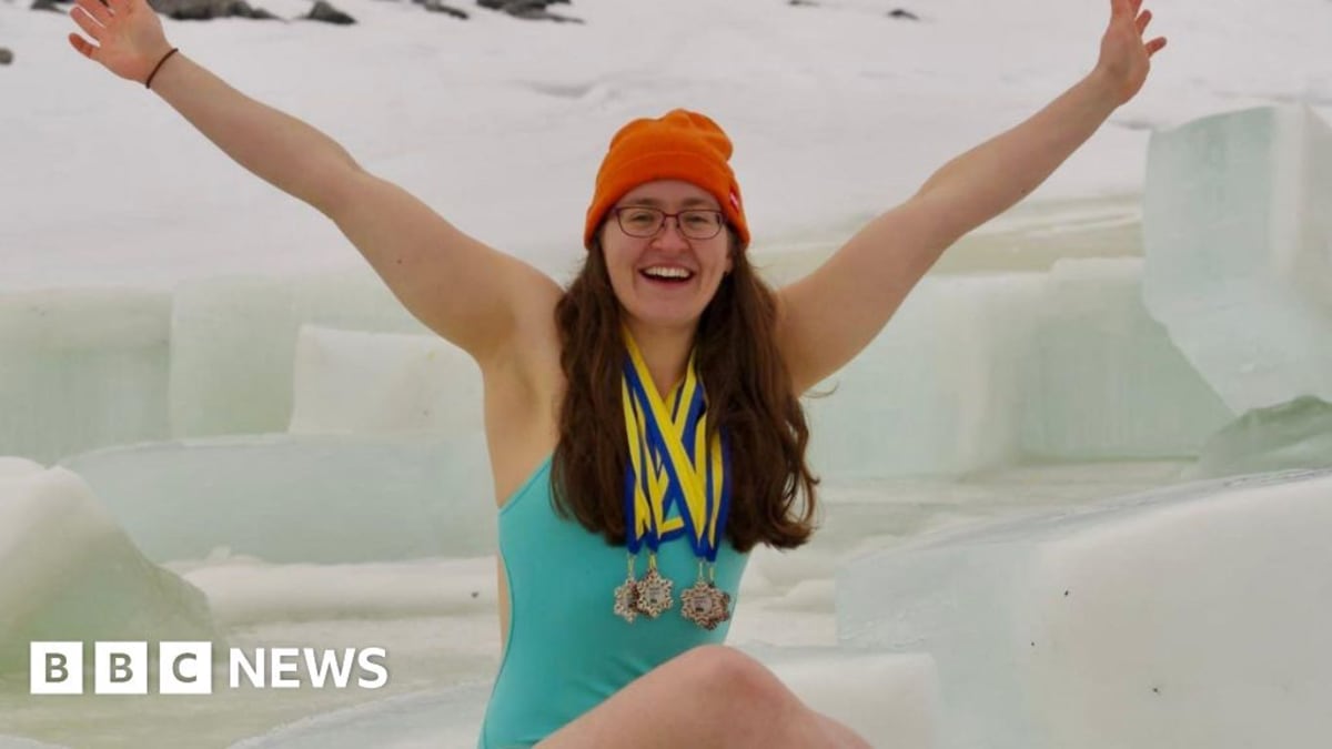 Ice swimmer Erin Medcalf in competition wearing swimsuit and goggles in freezing water