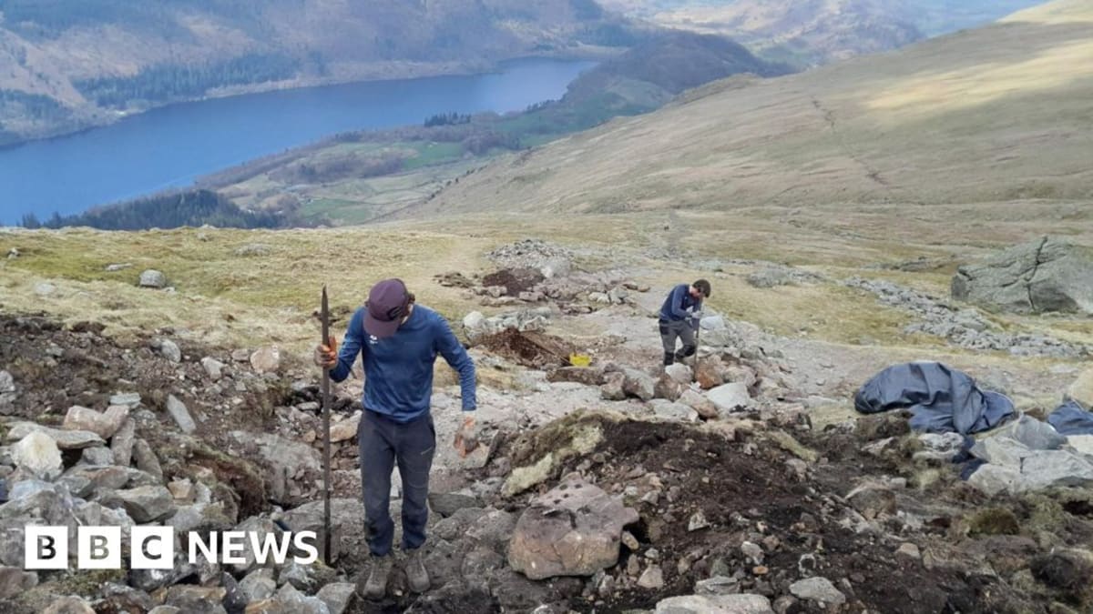 Rangers working on stone path restoration on Helvellyn mountain in England's Lake District