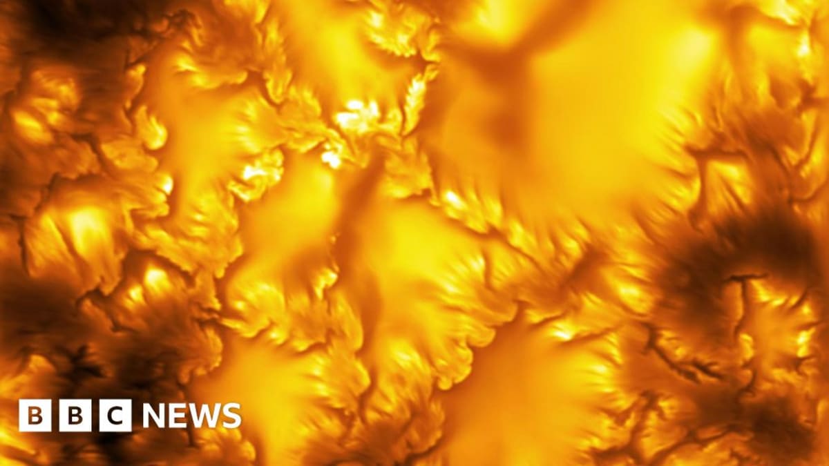 High-resolution close-up of the Sun's surface showing swirling whirlpool patterns of hot gas