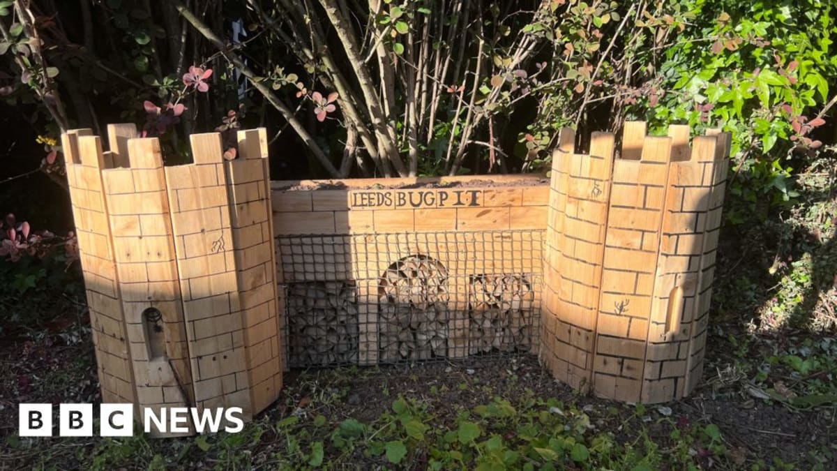 Miniature wooden bug hotel replica of Headingley Bear Pit at Leeds train station