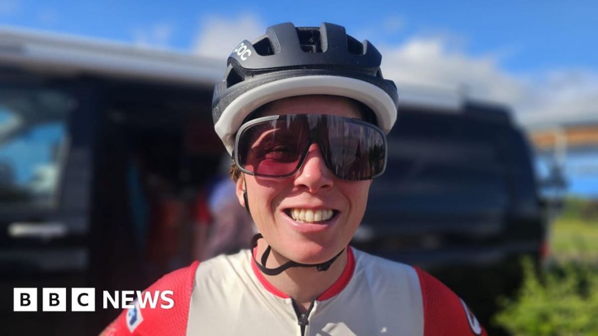 Laura Massey-Pugh running on road during her 40 consecutive iron-distance triathlon world record attempt