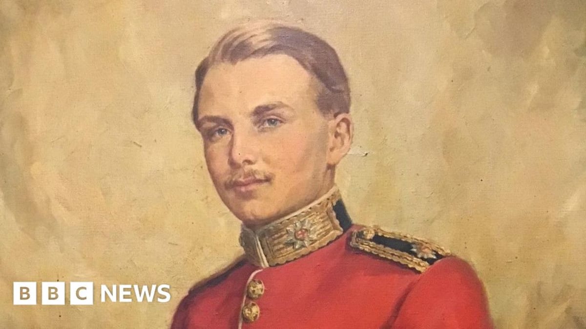 Military headstone at Warhem Communal Cemetery with fresh flowers honoring 2nd Lt Speed