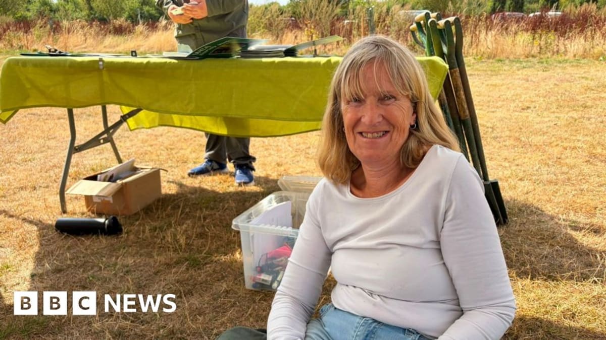 Volunteer tree warden Jan Miles learning tree surveying techniques at Mouldon Hill Country Park in Swindon