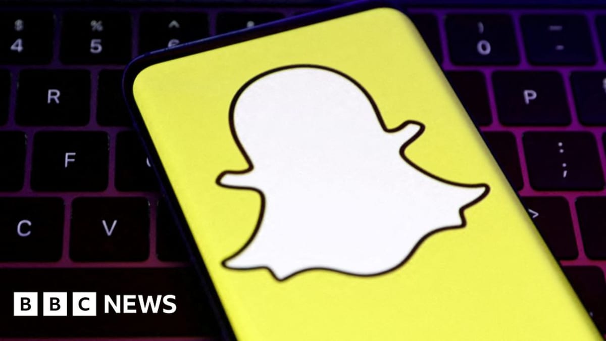 Snapchat app icon on smartphone screen with social media engagement symbols