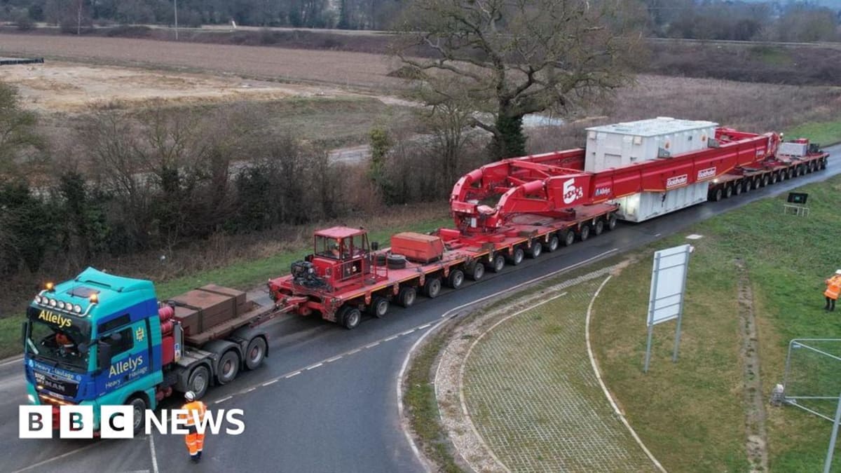 Massive offshore wind turbine monopile foundation being installed in ocean off Norfolk coast
