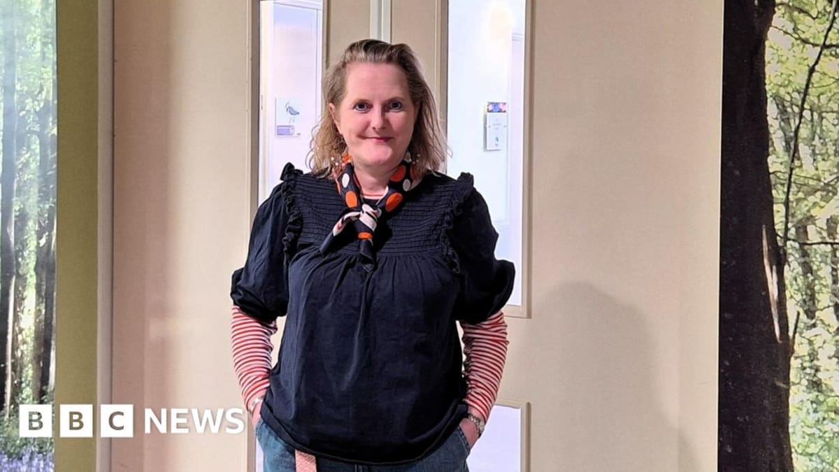 Jo Argyle smiling outdoors, breast cancer survivor and teacher preparing for charity walk
