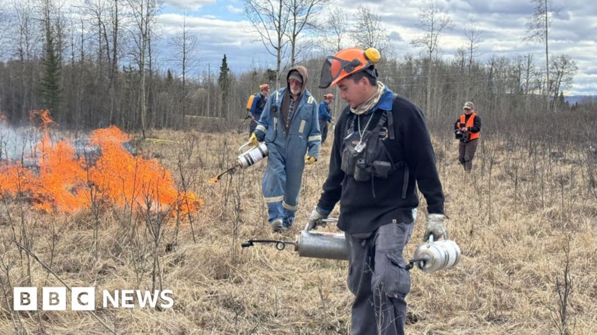 Community members in rural Canada practicing wildfire suppression techniques with fire wagon equipment