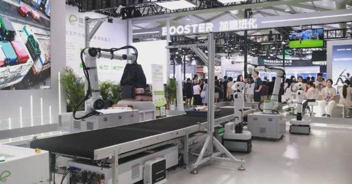 ** Advanced robotic arms sorting luggage on conveyor belt at automated airport baggage system