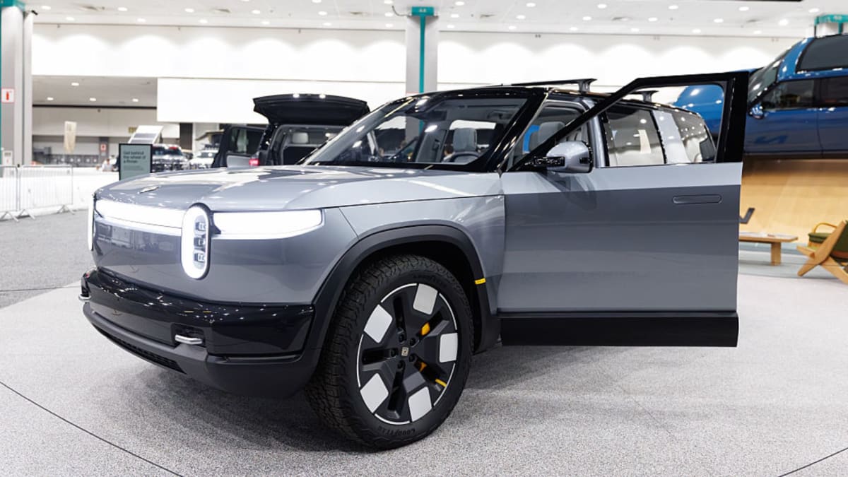 Rivian R2 electric vehicle on display, future platform for autonomous robotaxis