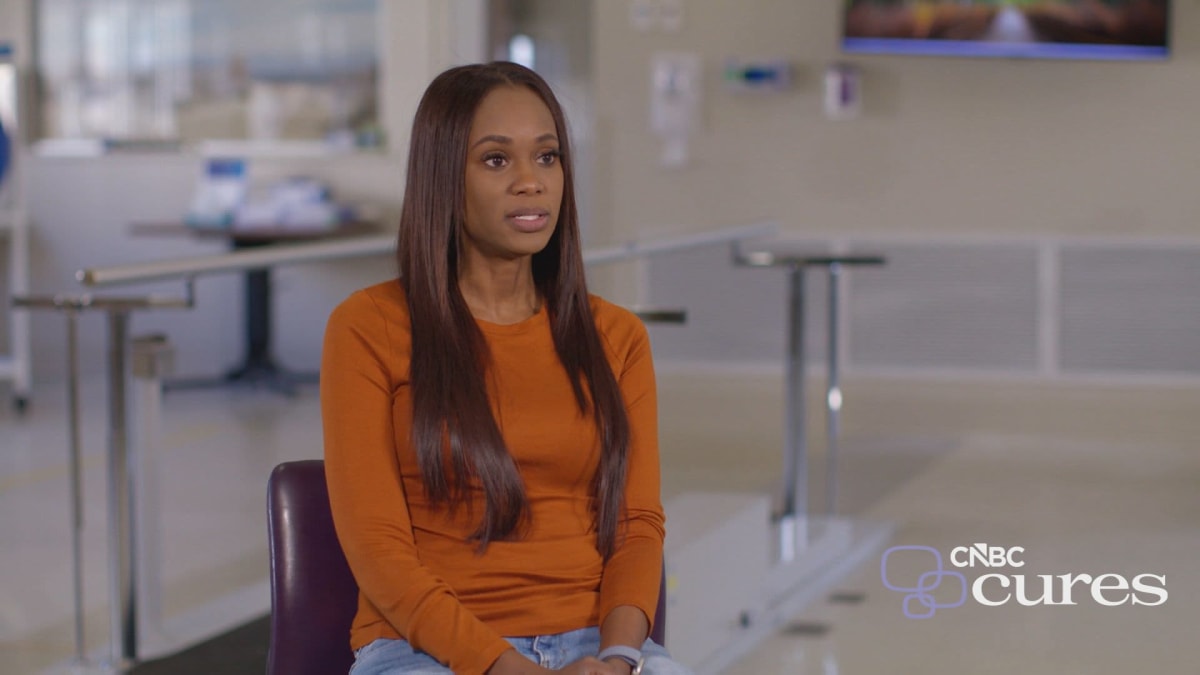 ** Marion Jones smiling at Boston Marathon finish line after recovering from paralysis