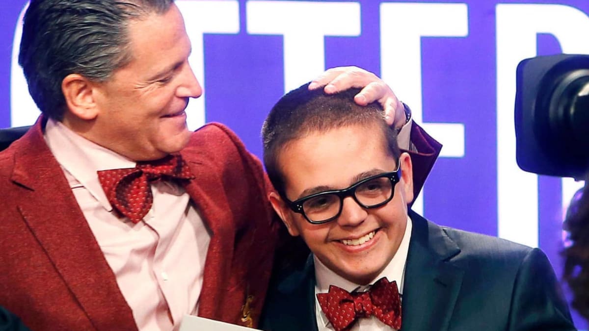 Dan Gilbert and his son Nick Gilbert smiling together at Cleveland Cavaliers event