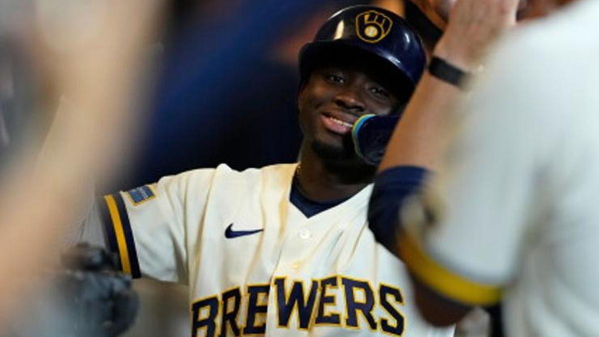 ** Milwaukee Brewers players celebrating historic 22-0 shutout victory against Seattle Mariners at home stadium