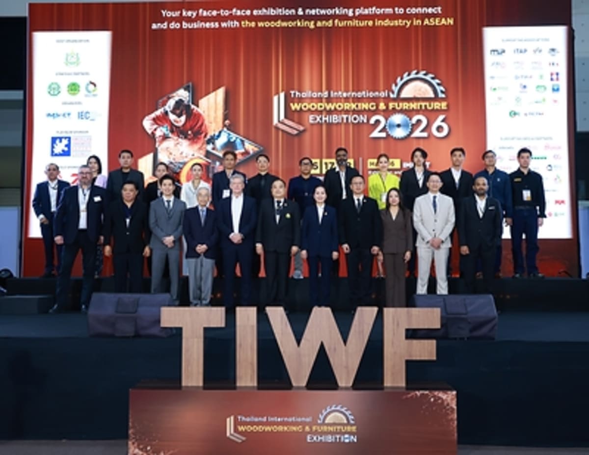 Large exhibition hall filled with woodworking machinery displays and international exhibitors at Thailand trade show