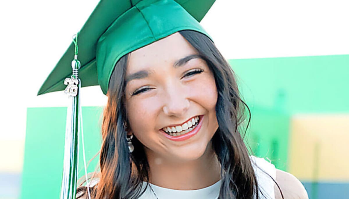 High school valedictorian Whitney Watkins receives certificate and scholarship award for community service