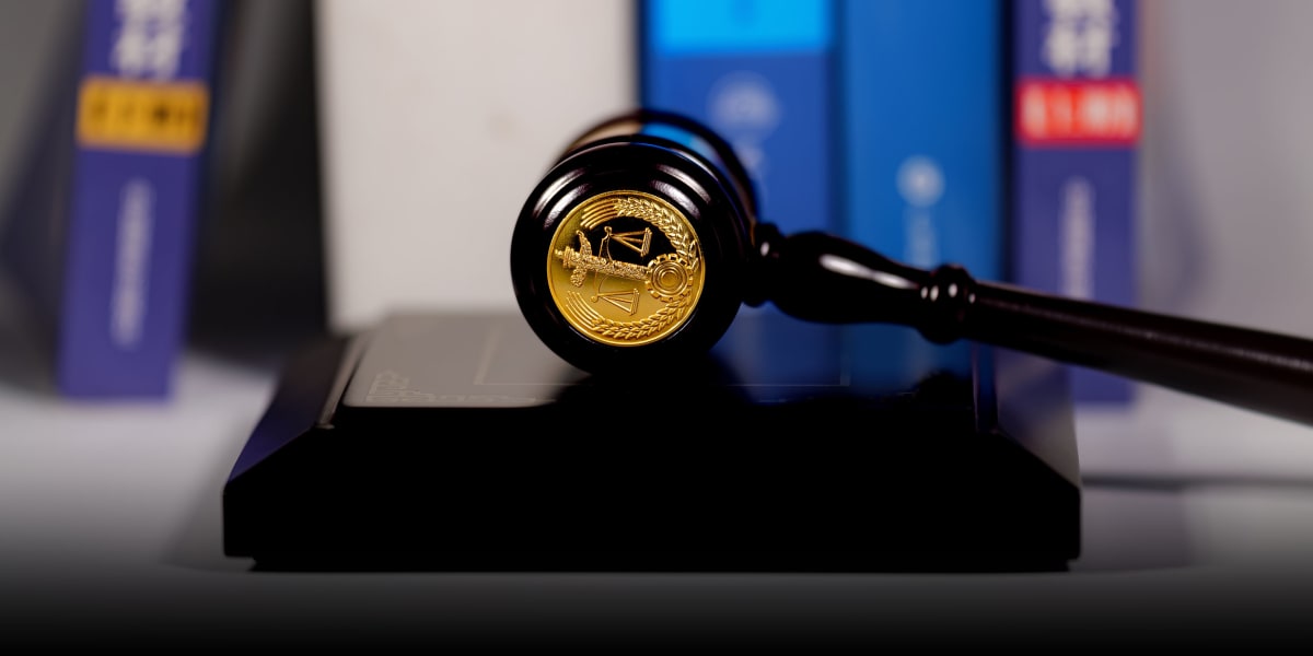 Diverse group of people receiving assistance from legal professionals in bright, welcoming office setting