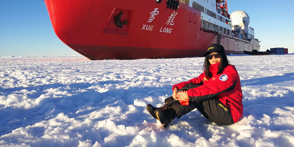 Marine geologist Tang Limei waving to camera after emerging from deep-sea submersible vessel