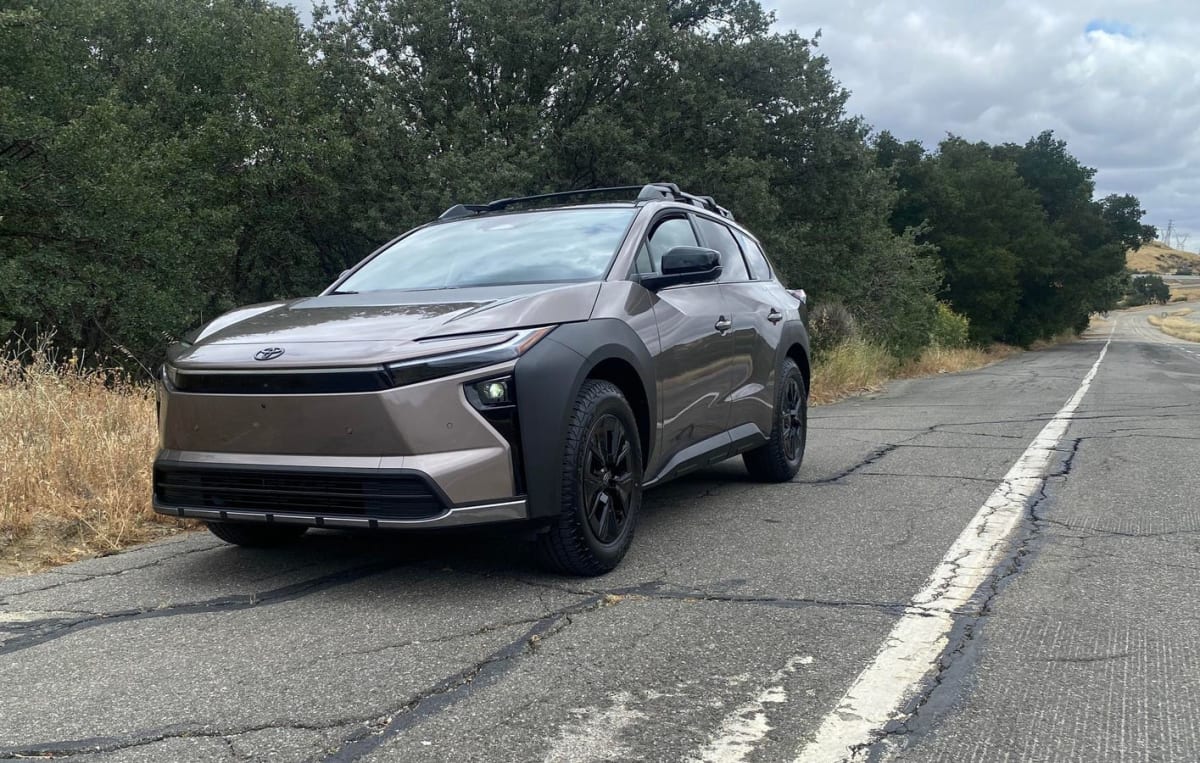 ** Silver Toyota bZ Woodland electric SUV parked at Tesla Supercharger station in Southern California