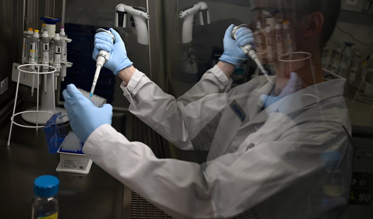 Researcher working with laboratory equipment in Moderna vaccine development facility