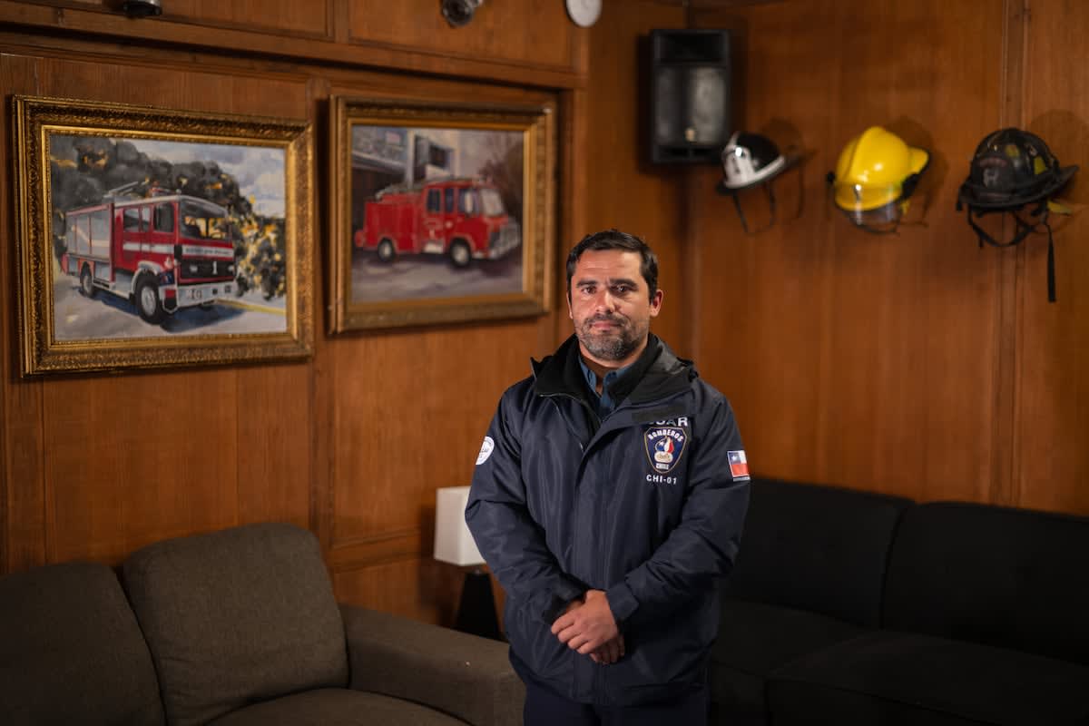 Rescue workers pulling survivor Hernán Gil from earthquake rubble in Venezuela