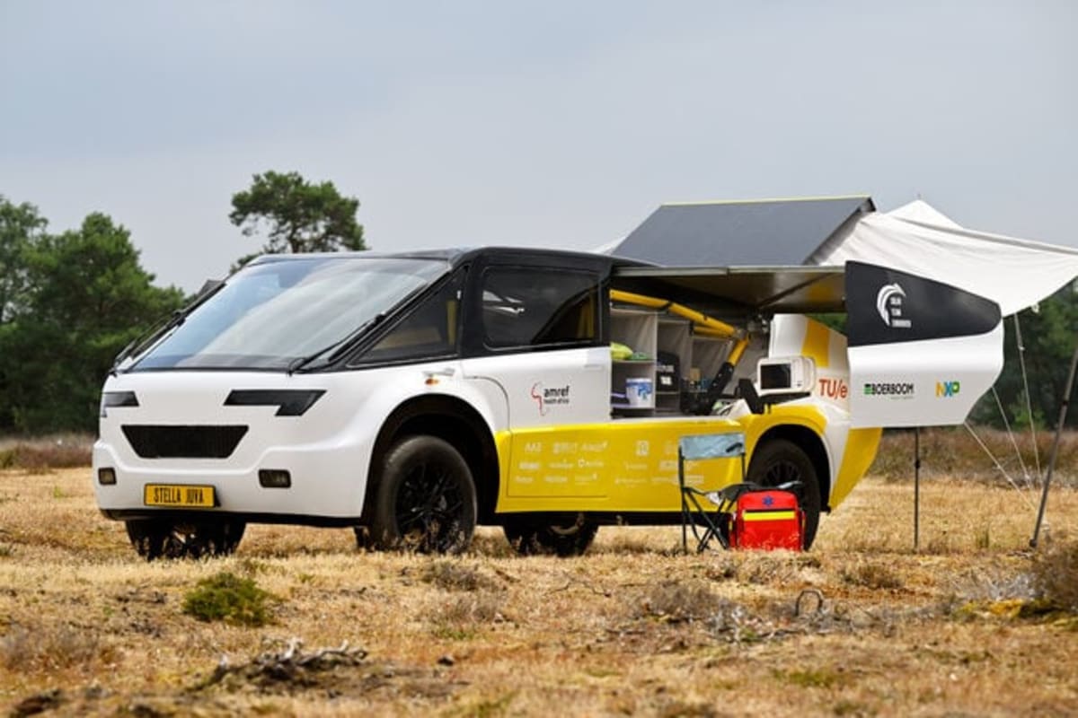 White and yellow solar-powered ambulance with rooftop panels designed by Dutch students