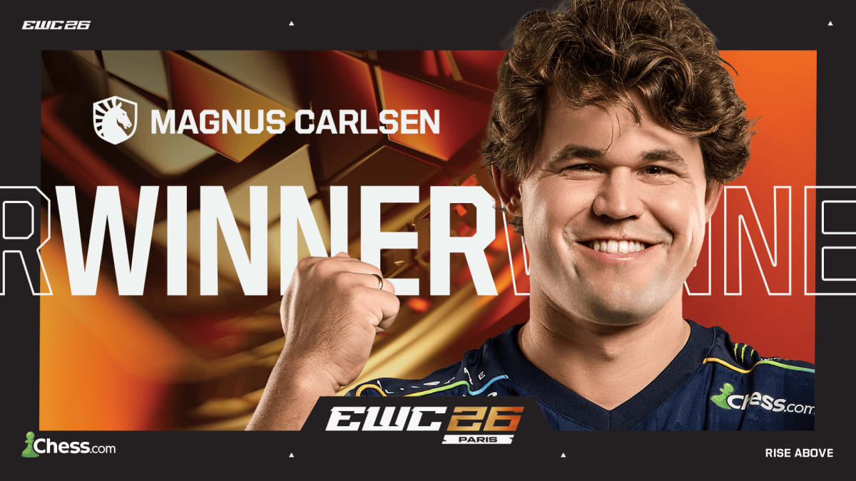 Magnus Carlsen holding the Esports World Cup trophy on stage in Paris