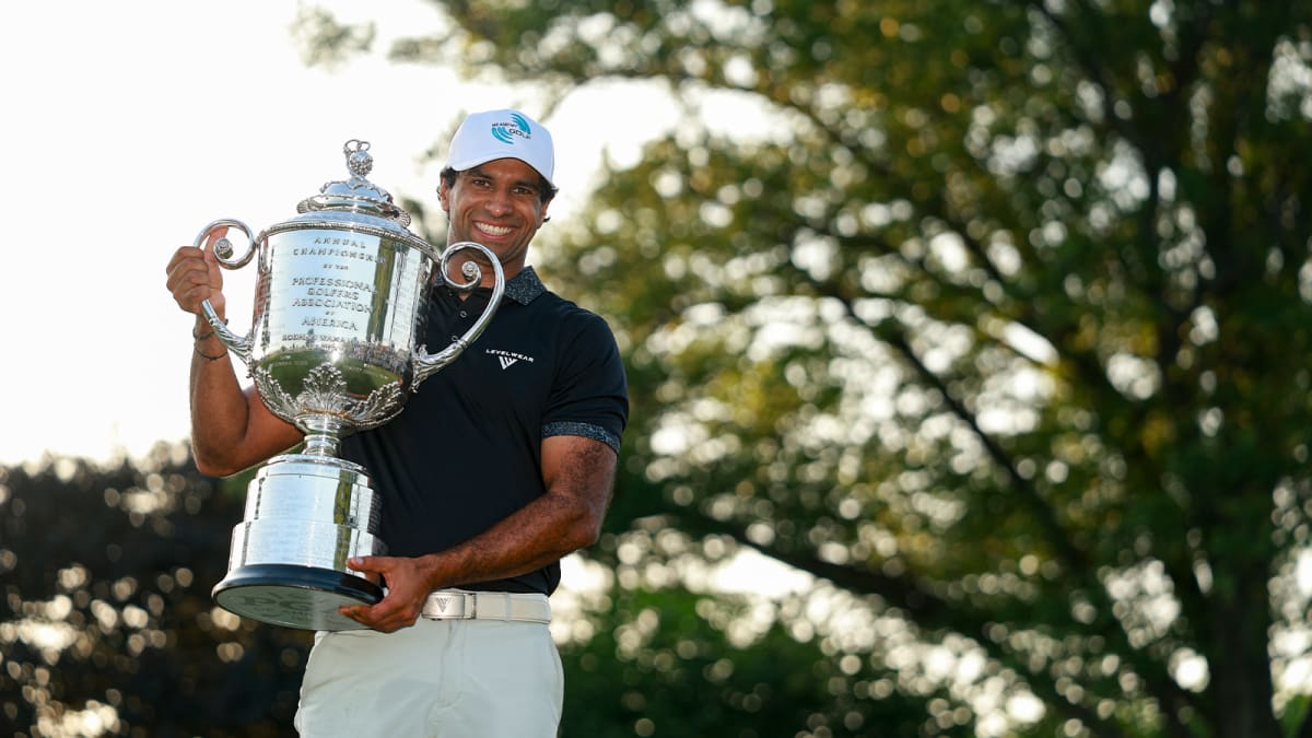 Aaron Rai celebrating with trophy after winning his first PGA Championship major title