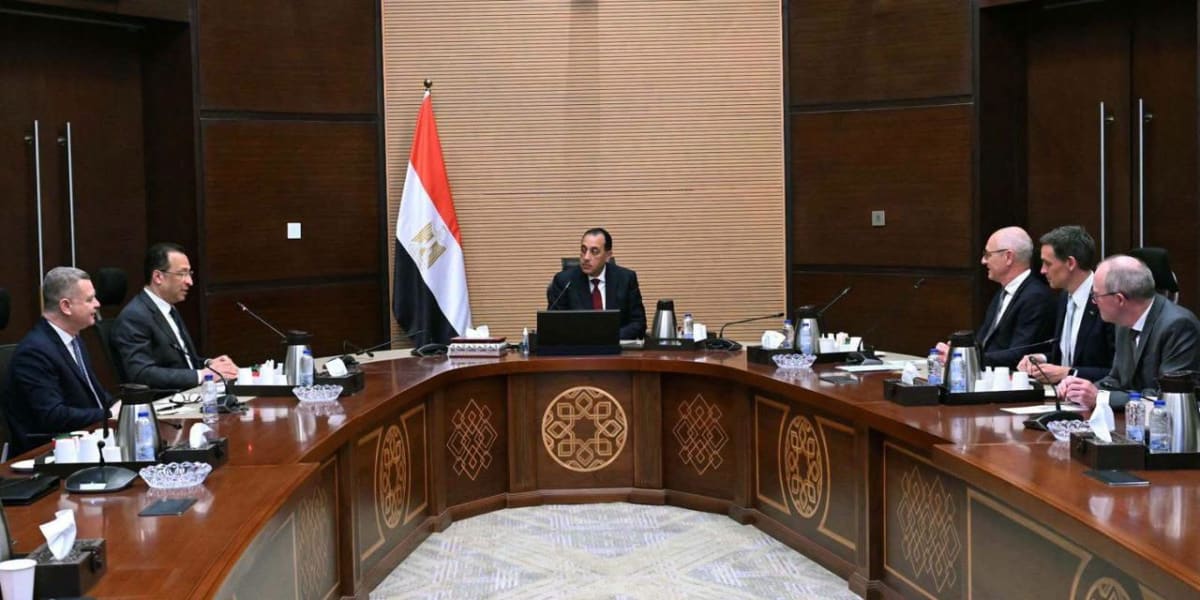 Egyptian engineers working on automotive software and artificial intelligence technology at modern computer workstations