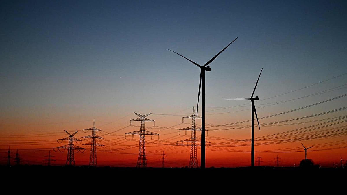 ** European family reviewing lower electricity bill at home with renewable energy symbols