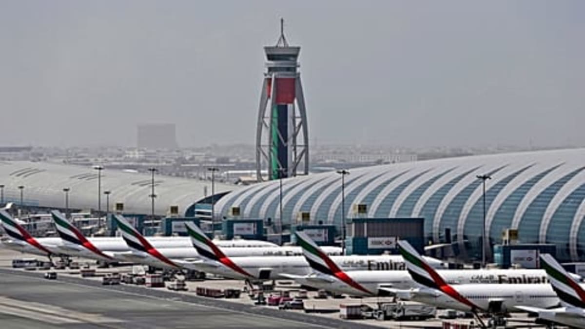 Multiple commercial aircraft parked in organized rows at Teruel Airport's vast storage facility in rural Spain