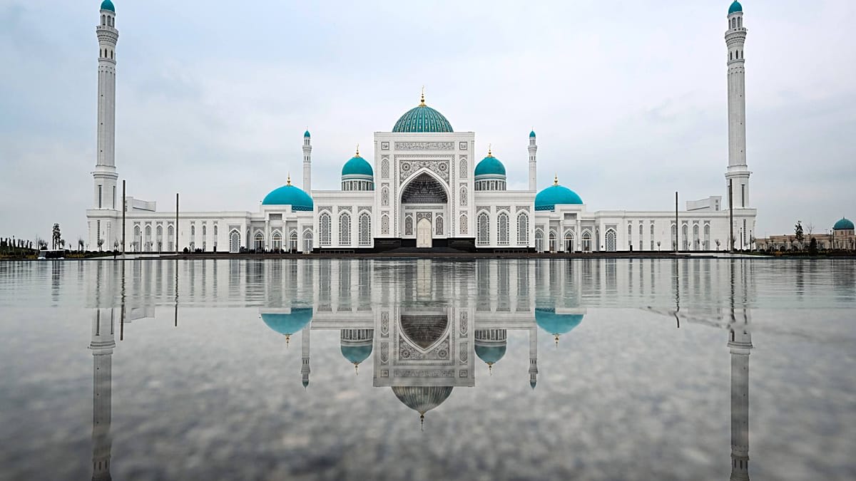 Grand mosque complex with four towering minarets and multiple domes in Samarkand, Uzbekistan