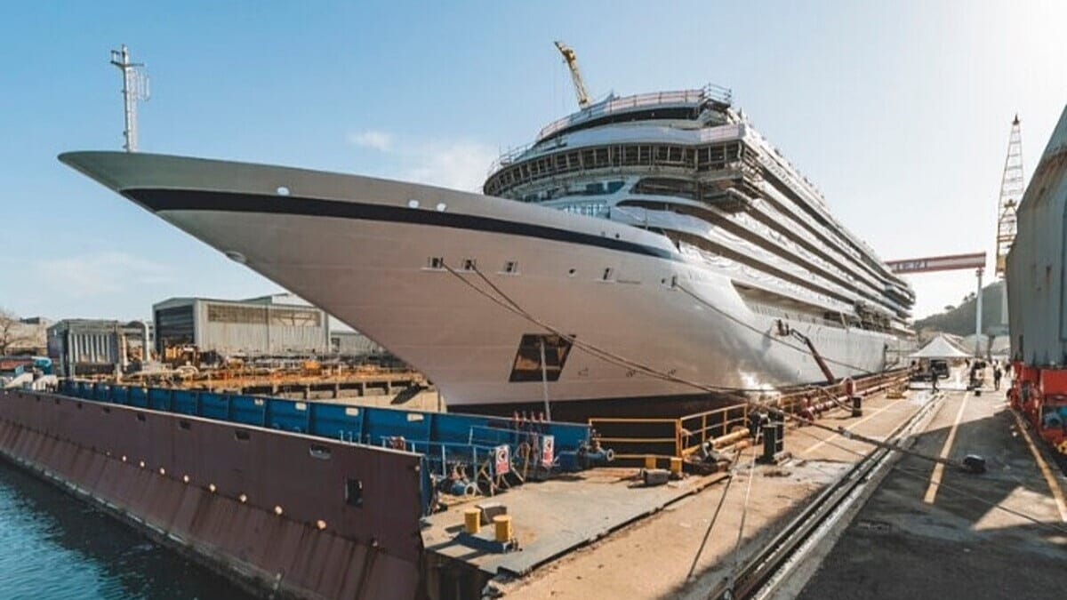 Viking Libra hydrogen-powered cruise ship floating in Italian shipyard during construction milestone
