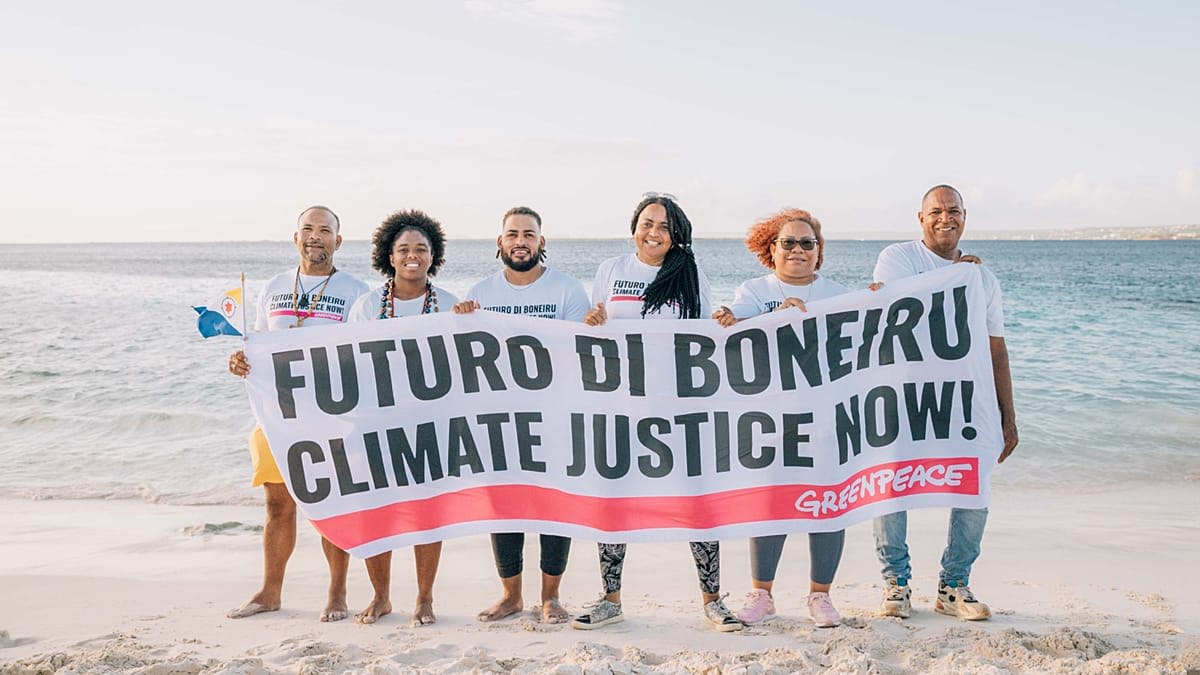 Farmer Onnie Emerenciana tends to vegetables growing in protective boxes on drought-stricken Bonaire island