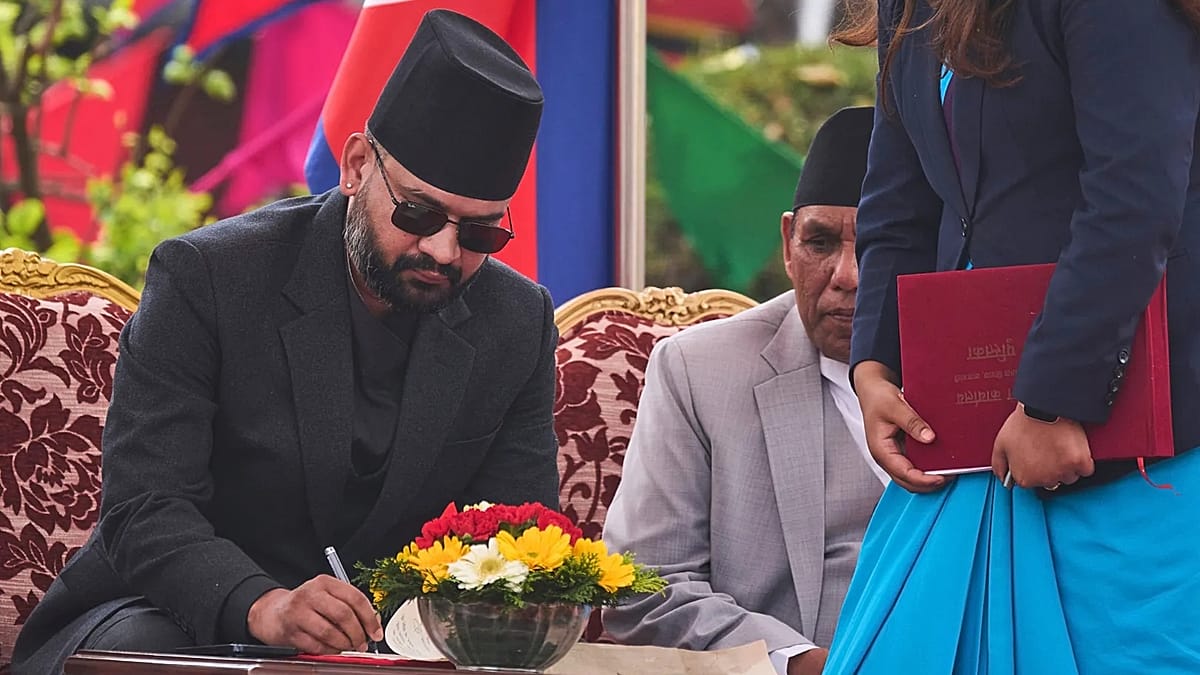 Balendra Shah shaking hands with Nepal's president after taking oath of office in Kathmandu