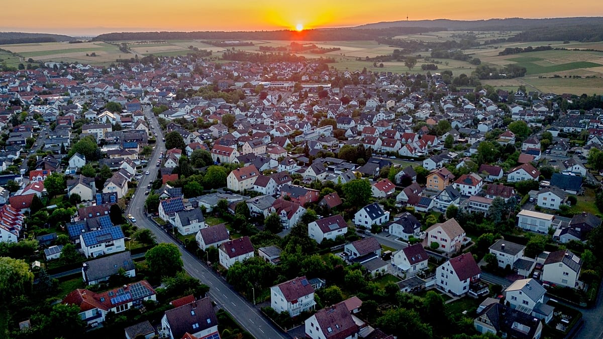 ** Wind turbines and solar panels generating renewable energy in rural German village of Feldheim