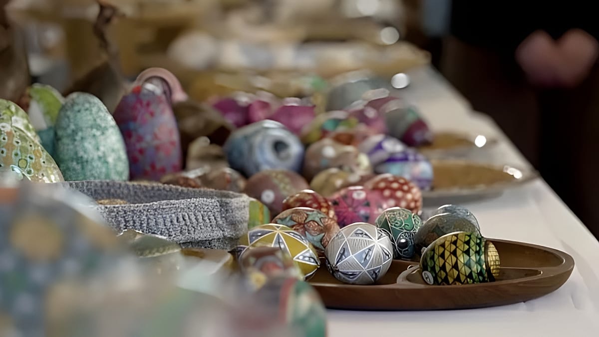 Intricately decorated Easter eggs displaying colorful traditional patterns at Leipzig's Eierlei Festival