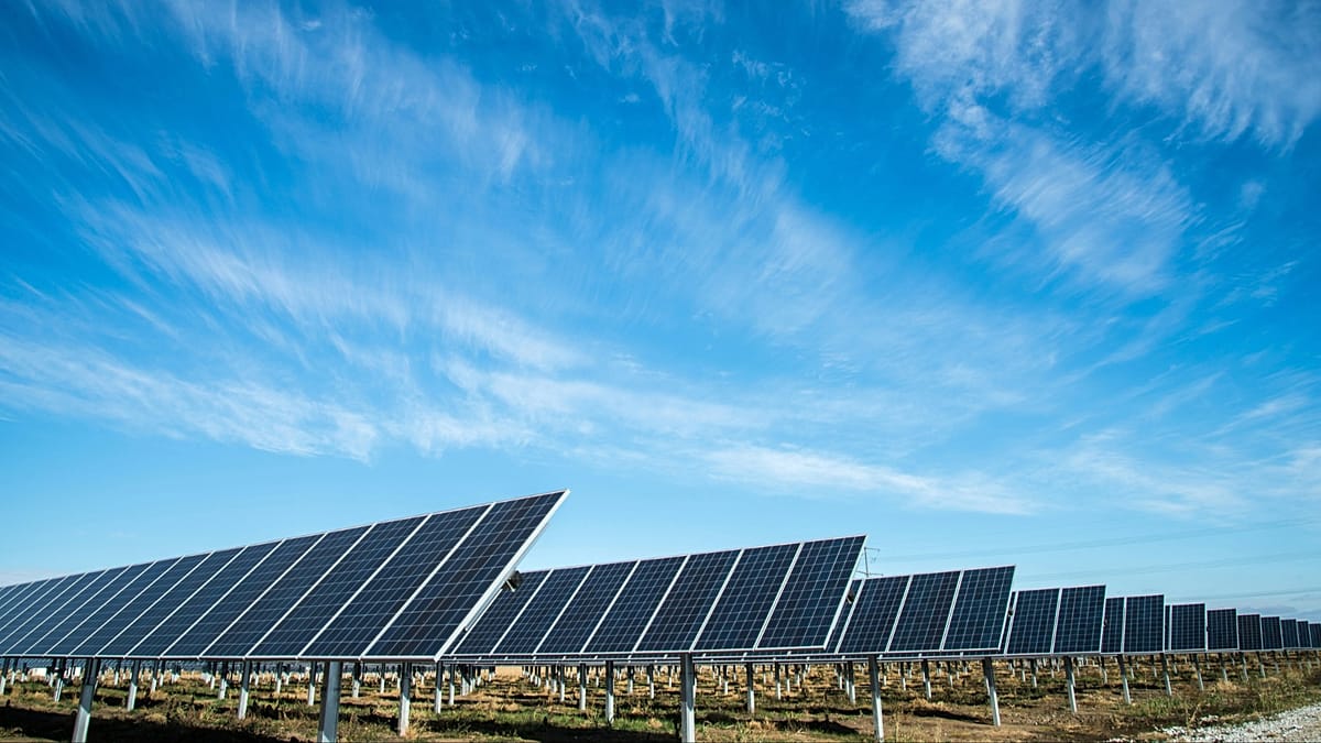 Solar panels gleaming under bright summer sun generating clean electricity for European power grid