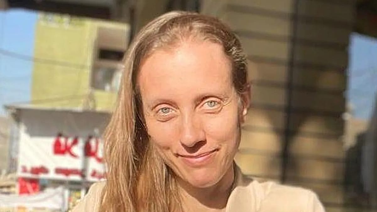 American journalist Shelly Kittleson smiling in a Baghdad cafe before her kidnapping