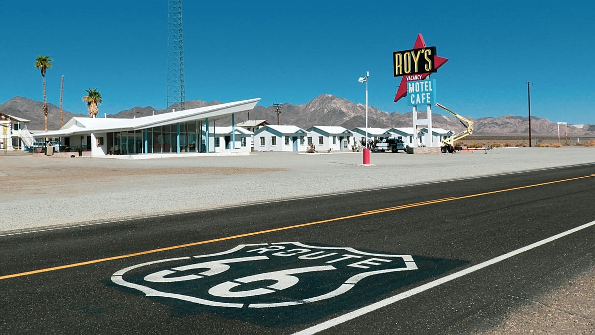 Vintage neon signs and restored classic diner along historic Route 66 highway