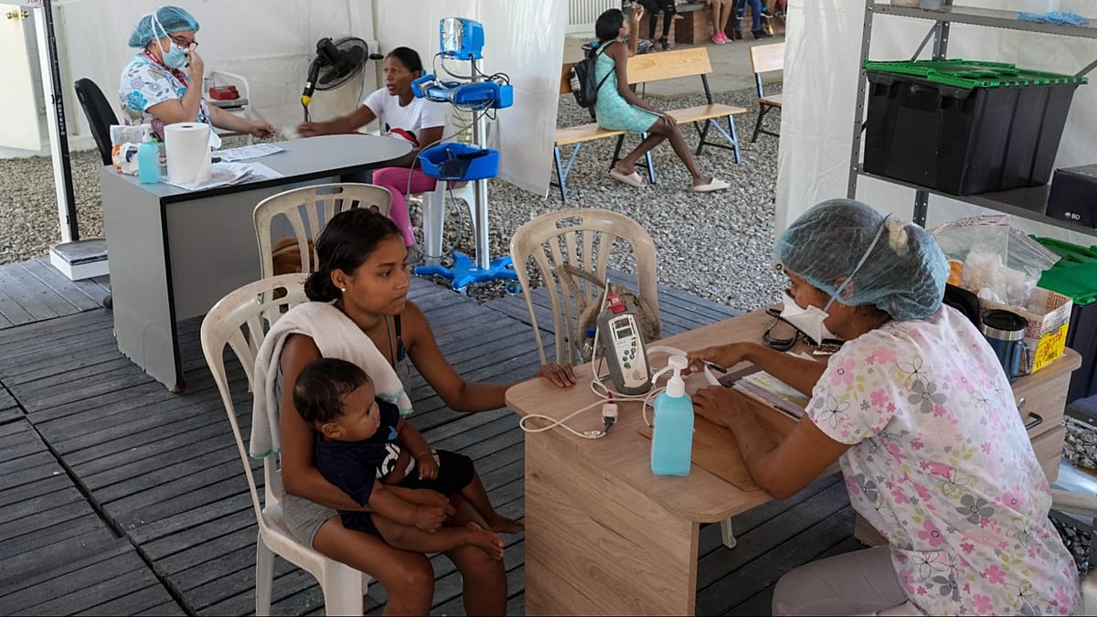 Healthcare workers distributing medicine and medical supplies in a community health clinic