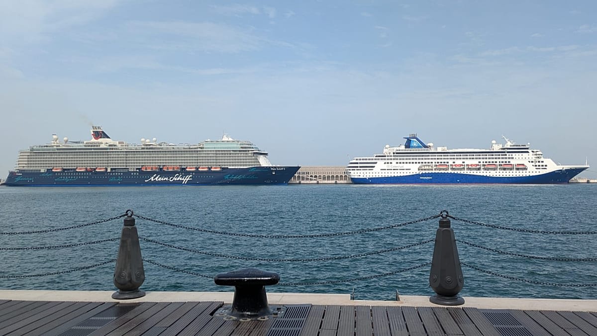 Large cruise ship sailing on open ocean waters toward European destination