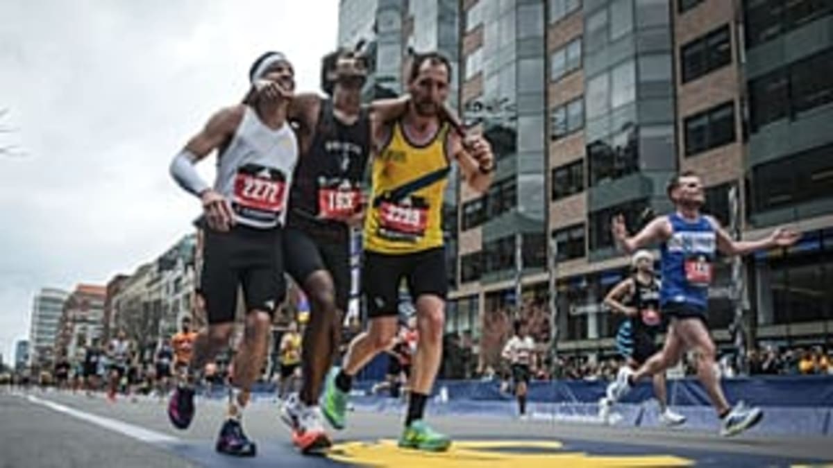 Two Runners Help Rival Cross Boston Marathon Finish Line - Image 3