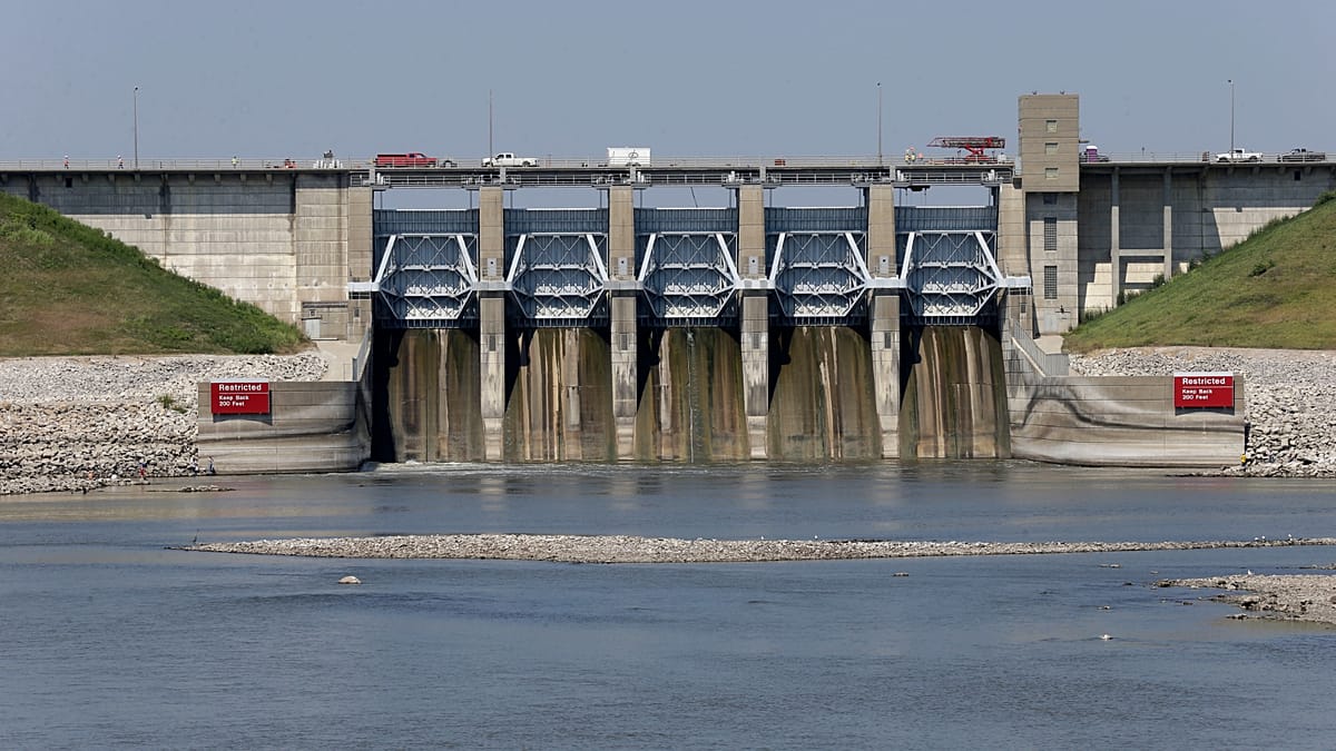 Hydroelectric dam on Naryn River in Kyrgyzstan with mountain landscape background