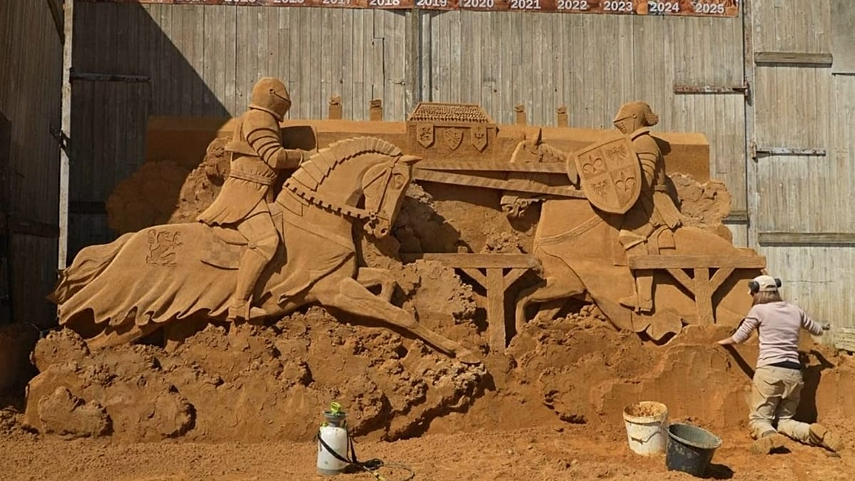 Medieval sand sculpture of kings playing chess at Danish beach festival