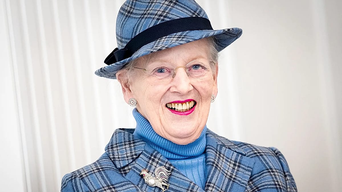Former Queen Margrethe of Denmark smiling in formal attire at royal event