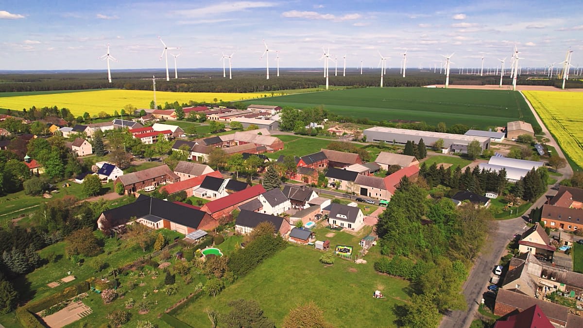 Wind turbines and solar panels generating renewable electricity for Feldheim village in eastern Germany