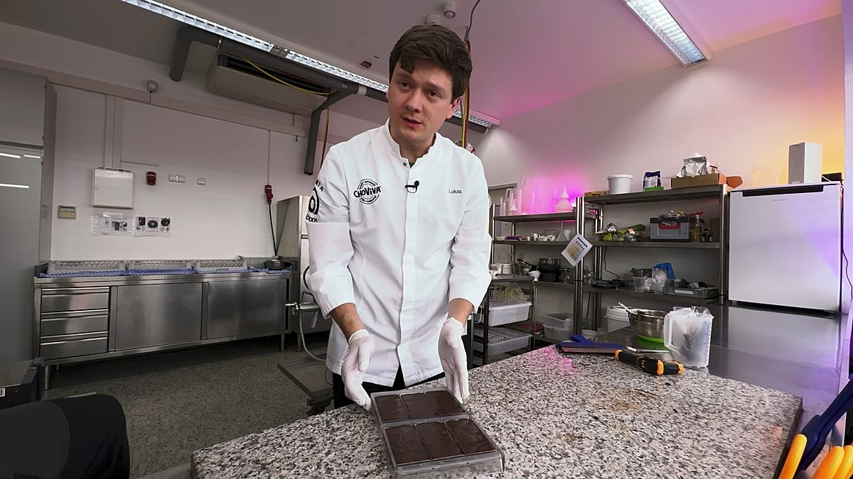 Sara Marquart holds ChoViva chocolate bar made from sunflower seeds in Munich laboratory