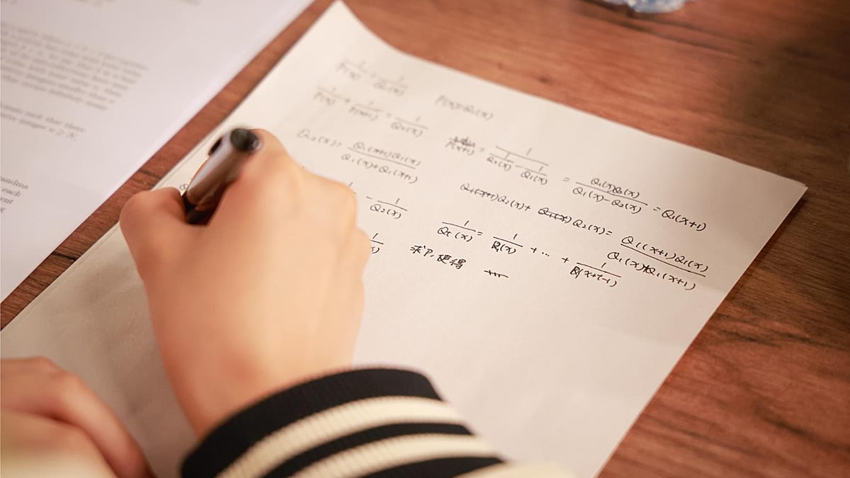 Young students working on mathematics problems at international competition in Tashkent, Uzbekistan
