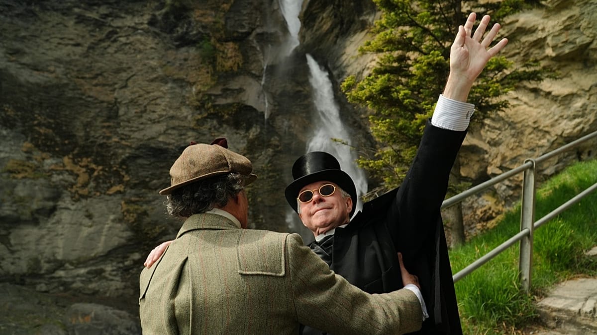 Victorian-costumed Sherlock Holmes Society members reenacting dramatic scene at Switzerland's Reichenbach Falls waterfall