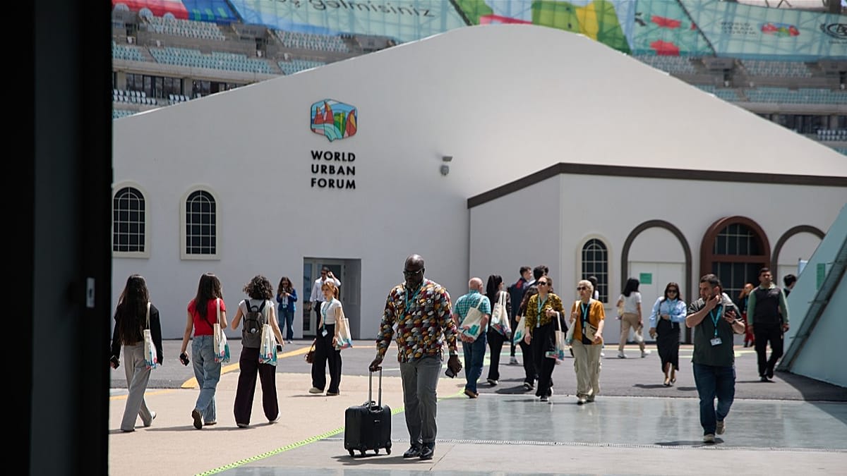 Large conference hall filled with thousands of delegates at World Urban Forum in Baku